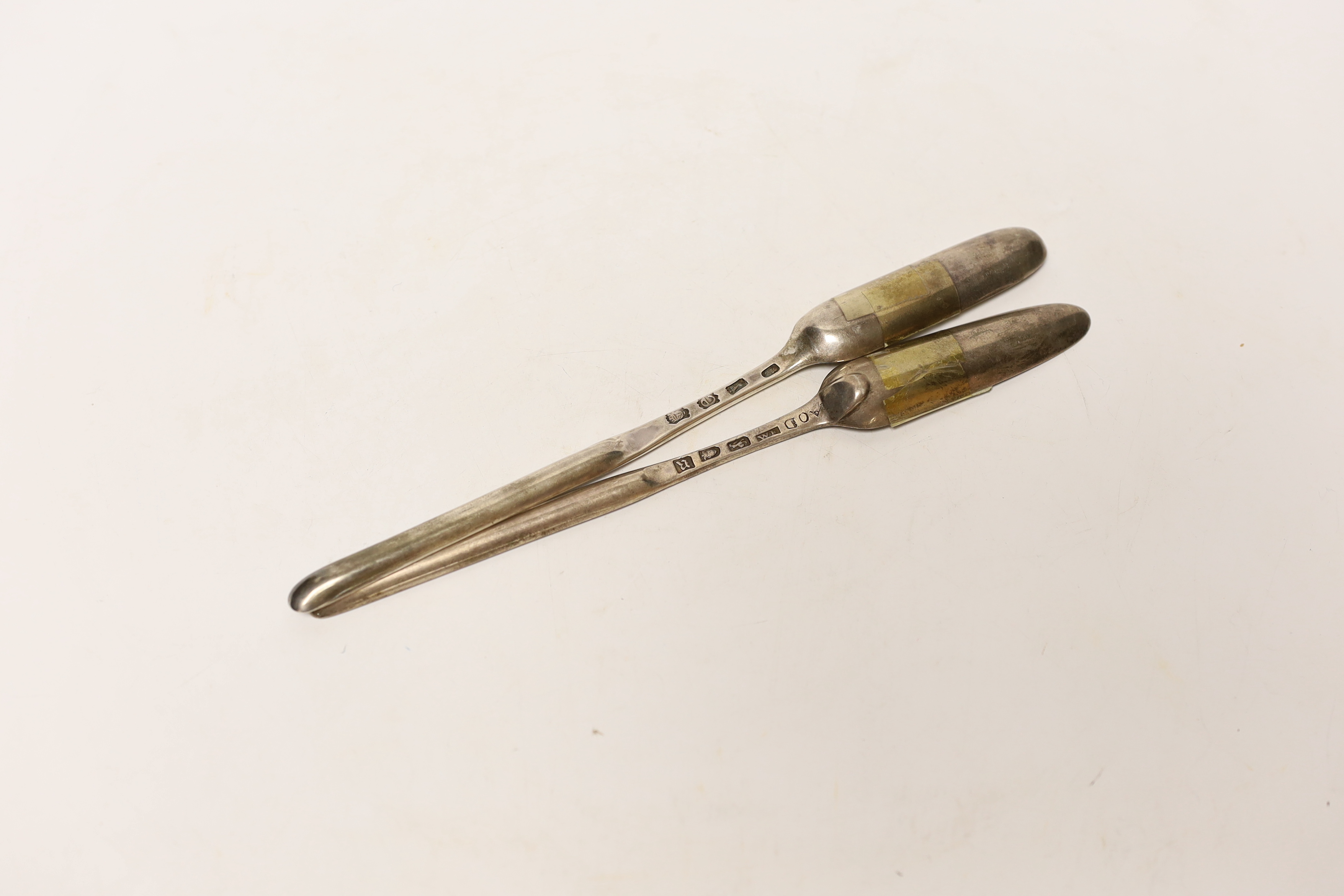 Two 18th century silver marrow scoops, feather edge engraved by William Fearn, London, 1772, 22.2cm, the other James Wilks, London, 1750, 90 grams.